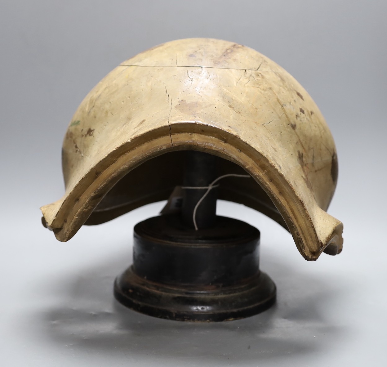 A World War One German beechwood helmet mould, 34cm wide, and five hatters’ blocks